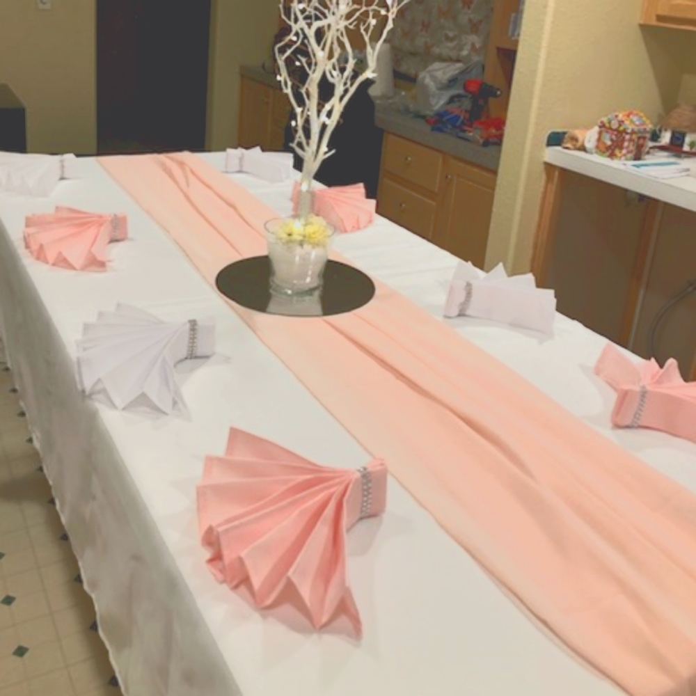 80 pink napkins folded and pressed